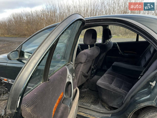 Зелений Опель Омега, об'ємом двигуна 2.96 л та пробігом 300 тис. км за 1350 $, фото 20 на Automoto.ua