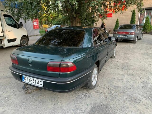 Зеленый Опель Омега, объемом двигателя 2 л и пробегом 300 тыс. км за 1600 $, фото 4 на Automoto.ua