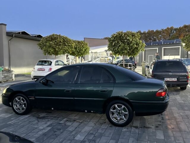 Зеленый Опель Омега, объемом двигателя 2 л и пробегом 250 тыс. км за 1400 $, фото 7 на Automoto.ua