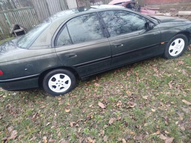 Зеленый Опель Омега, объемом двигателя 2 л и пробегом 355 тыс. км за 1300 $, фото 3 на Automoto.ua