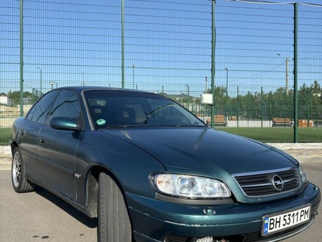 Зеленый Опель Омега, объемом двигателя 2.5 л и пробегом 300 тыс. км за 2500 $, фото 3 на Automoto.ua