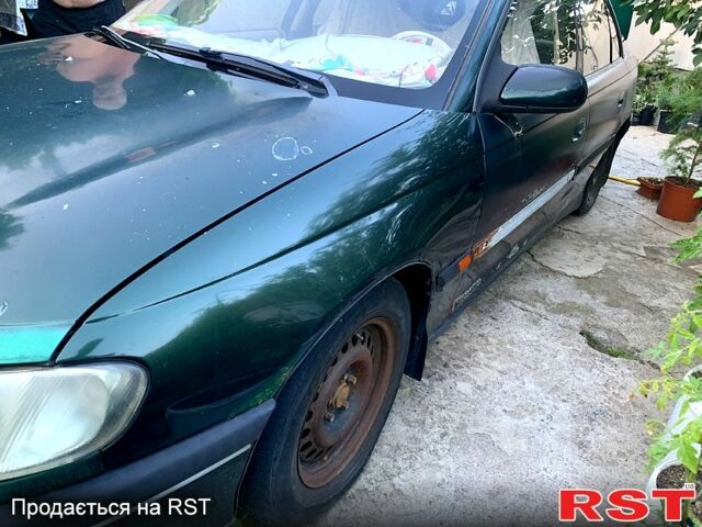 Зеленый Опель Омега, объемом двигателя 2 л и пробегом 250 тыс. км за 800 $, фото 2 на Automoto.ua