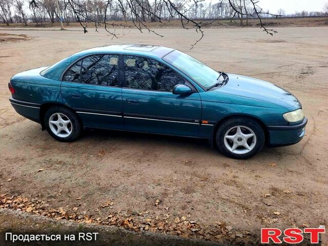 Зеленый Опель Омега, объемом двигателя 2 л и пробегом 350 тыс. км за 2100 $, фото 2 на Automoto.ua