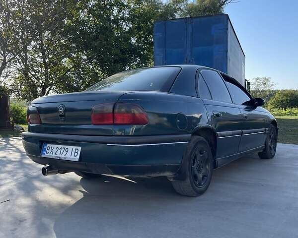 Зеленый Опель Омега, объемом двигателя 2 л и пробегом 350 тыс. км за 2100 $, фото 4 на Automoto.ua