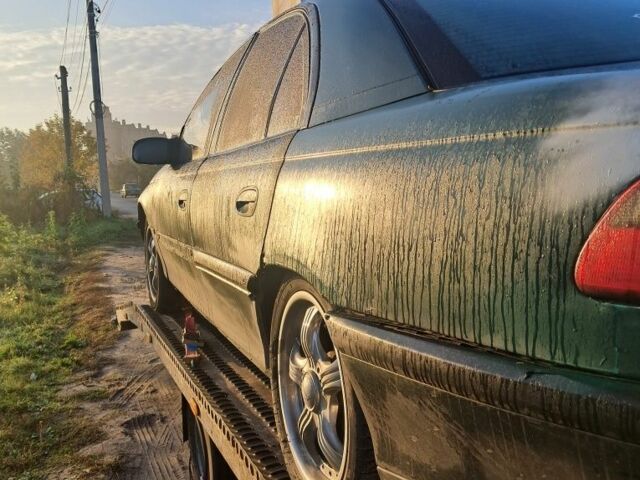 Зеленый Опель Омега, объемом двигателя 2 л и пробегом 390 тыс. км за 400 $, фото 6 на Automoto.ua