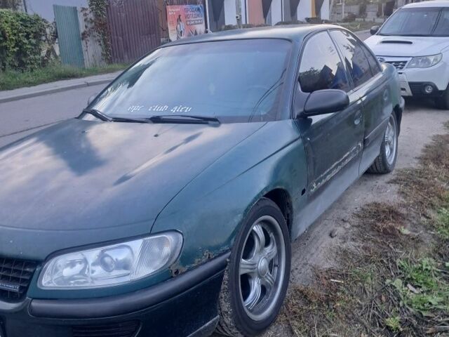 Зеленый Опель Омега, объемом двигателя 2 л и пробегом 390 тыс. км за 400 $, фото 4 на Automoto.ua