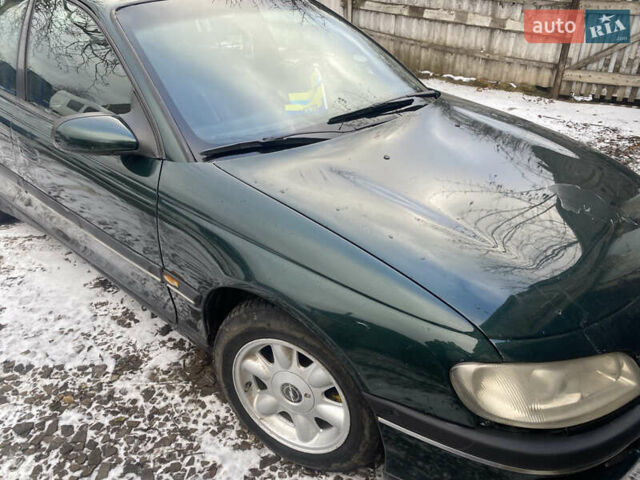 Зеленый Опель Омега, объемом двигателя 1.8 л и пробегом 100 тыс. км за 1750 $, фото 7 на Automoto.ua