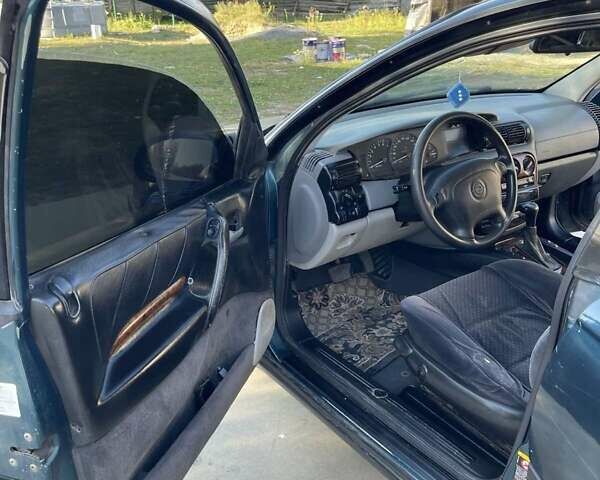 Зеленый Опель Омега, объемом двигателя 2 л и пробегом 300 тыс. км за 1800 $, фото 14 на Automoto.ua
