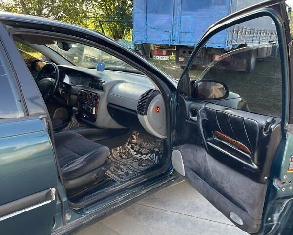 Зеленый Опель Омега, объемом двигателя 2 л и пробегом 300 тыс. км за 1800 $, фото 12 на Automoto.ua