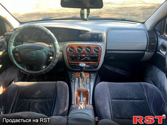 Зелений Опель Омега, об'ємом двигуна 2 л та пробігом 400 тис. км за 1700 $, фото 10 на Automoto.ua