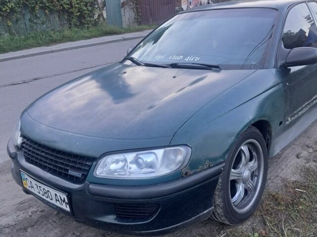 Зеленый Опель Омега, объемом двигателя 2 л и пробегом 390 тыс. км за 400 $, фото 5 на Automoto.ua