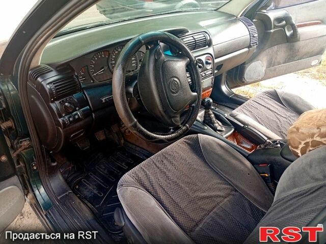 Зеленый Опель Омега, объемом двигателя 2 л и пробегом 600 тыс. км за 1400 $, фото 7 на Automoto.ua