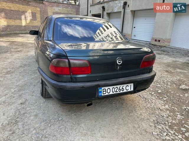 Зелений Опель Омега, об'ємом двигуна 2 л та пробігом 451 тис. км за 1200 $, фото 19 на Automoto.ua