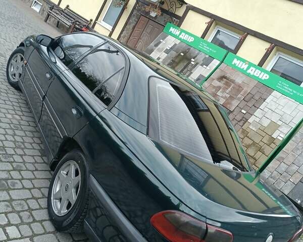 Зеленый Опель Омега, объемом двигателя 2.5 л и пробегом 400 тыс. км за 2150 $, фото 2 на Automoto.ua