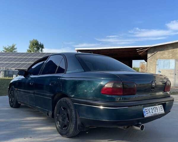 Зеленый Опель Омега, объемом двигателя 2 л и пробегом 300 тыс. км за 1800 $, фото 4 на Automoto.ua