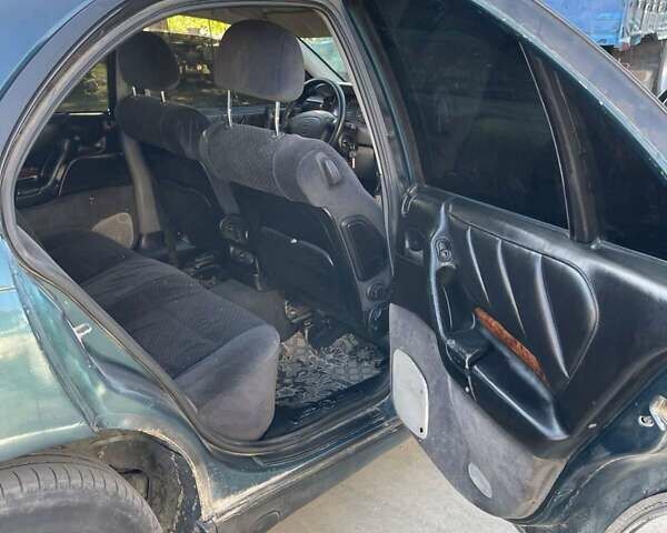 Зеленый Опель Омега, объемом двигателя 2 л и пробегом 350 тыс. км за 2100 $, фото 10 на Automoto.ua