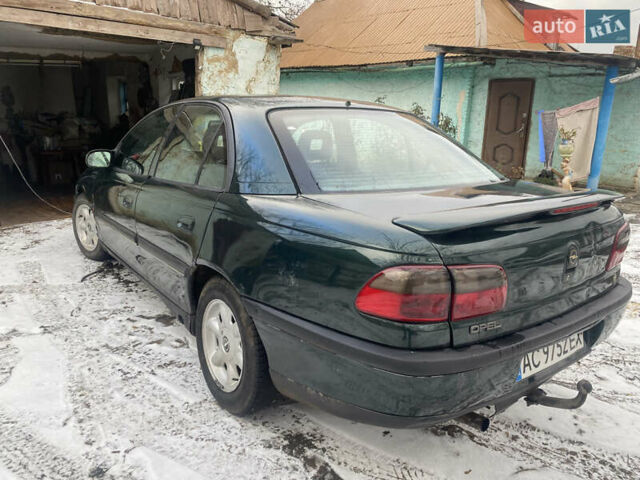 Зеленый Опель Омега, объемом двигателя 1.8 л и пробегом 100 тыс. км за 1750 $, фото 4 на Automoto.ua