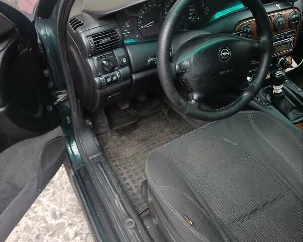 Зелений Опель Омега, об'ємом двигуна 2 л та пробігом 35 тис. км за 2950 $, фото 8 на Automoto.ua