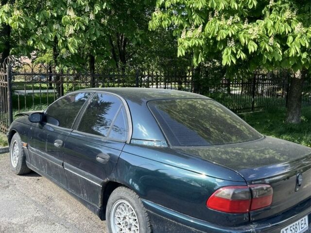 Зеленый Опель Омега, объемом двигателя 2 л и пробегом 400 тыс. км за 600 $, фото 6 на Automoto.ua