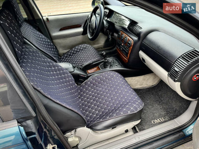 Зеленый Опель Омега, объемом двигателя 2 л и пробегом 315 тыс. км за 2950 $, фото 18 на Automoto.ua