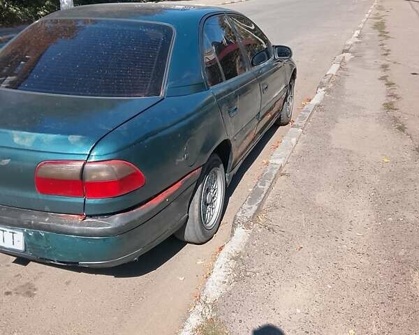 Зеленый Опель Омега, объемом двигателя 2 л и пробегом 300 тыс. км за 2000 $, фото 3 на Automoto.ua