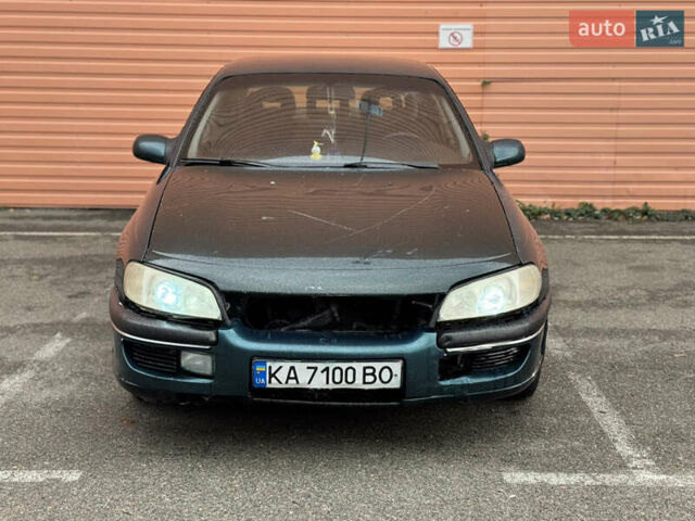 Зеленый Опель Омега, объемом двигателя 2 л и пробегом 250 тыс. км за 1250 $, фото 1 на Automoto.ua