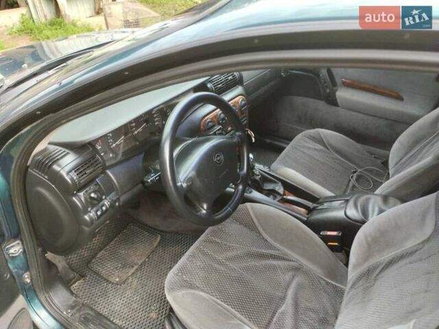 Зеленый Опель Омега, объемом двигателя 2 л и пробегом 423 тыс. км за 1500 $, фото 4 на Automoto.ua