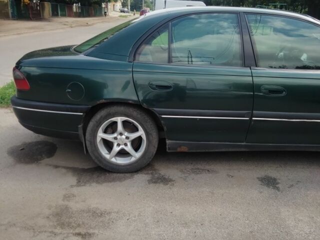 Зелений Опель Омега, об'ємом двигуна 2 л та пробігом 520 тис. км за 2000 $, фото 5 на Automoto.ua