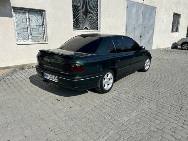 Зеленый Опель Омега, объемом двигателя 2 л и пробегом 240 тыс. км за 3500 $, фото 1 на Automoto.ua