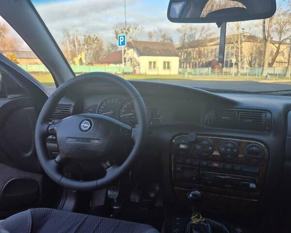 Зеленый Опель Омега, объемом двигателя 2.6 л и пробегом 270 тыс. км за 2500 $, фото 11 на Automoto.ua