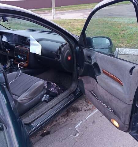 Зеленый Опель Омега, объемом двигателя 2 л и пробегом 323 тыс. км за 2250 $, фото 2 на Automoto.ua