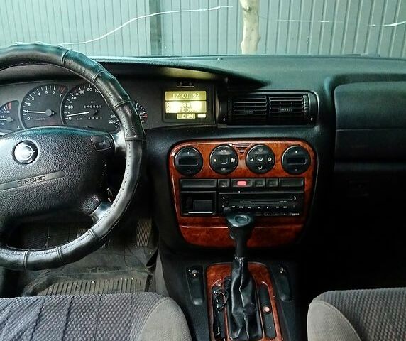 Зеленый Опель Омега, объемом двигателя 2 л и пробегом 250 тыс. км за 2000 $, фото 7 на Automoto.ua