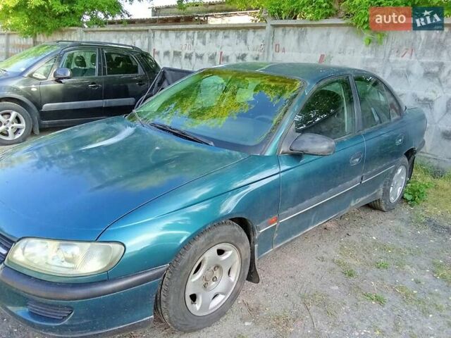 Зеленый Опель Омега, объемом двигателя 2 л и пробегом 236 тыс. км за 1500 $, фото 1 на Automoto.ua