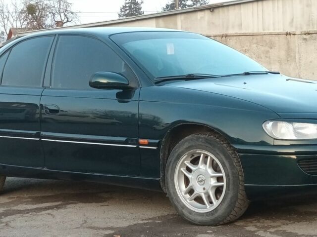 Зеленый Опель Омега, объемом двигателя 2 л и пробегом 380 тыс. км за 2600 $, фото 7 на Automoto.ua