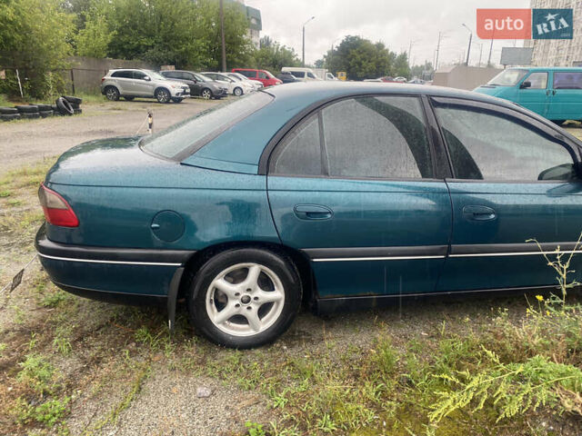 Зеленый Опель Омега, объемом двигателя 2 л и пробегом 298 тыс. км за 3200 $, фото 4 на Automoto.ua