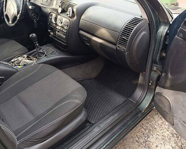 Зеленый Опель Омега, объемом двигателя 2 л и пробегом 320 тыс. км за 2600 $, фото 9 на Automoto.ua