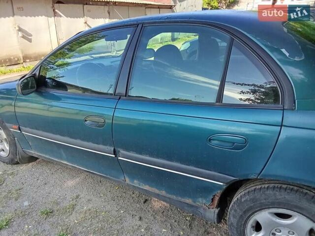 Зеленый Опель Омега, объемом двигателя 2 л и пробегом 236 тыс. км за 1500 $, фото 2 на Automoto.ua