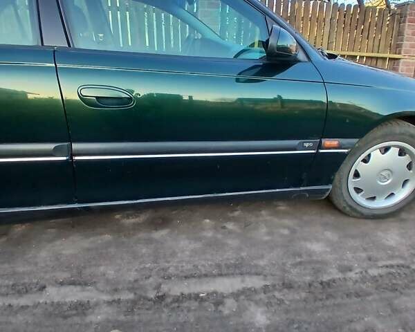 Зелений Опель Омега, об'ємом двигуна 2 л та пробігом 397 тис. км за 1000 $, фото 4 на Automoto.ua