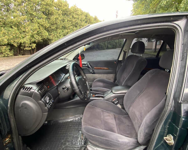 Зеленый Опель Омега, объемом двигателя 2 л и пробегом 300 тыс. км за 1750 $, фото 23 на Automoto.ua
