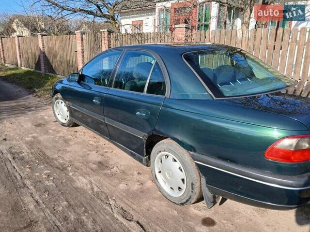 Зелений Опель Омега, об'ємом двигуна 2 л та пробігом 397 тис. км за 1000 $, фото 10 на Automoto.ua