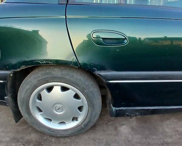 Зелений Опель Омега, об'ємом двигуна 2 л та пробігом 397 тис. км за 1000 $, фото 5 на Automoto.ua