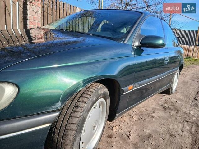Зелений Опель Омега, об'ємом двигуна 2 л та пробігом 397 тис. км за 1000 $, фото 11 на Automoto.ua