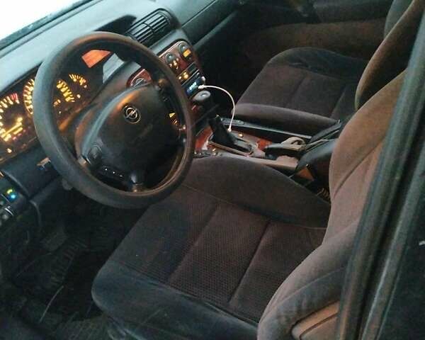 Зелений Опель Омега, об'ємом двигуна 2 л та пробігом 264 тис. км за 3498 $, фото 4 на Automoto.ua