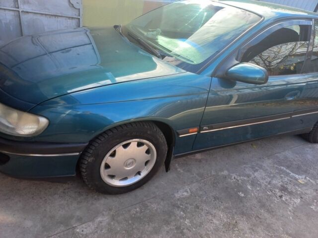 Зеленый Опель Омега, объемом двигателя 2 л и пробегом 402 тыс. км за 4000 $, фото 1 на Automoto.ua