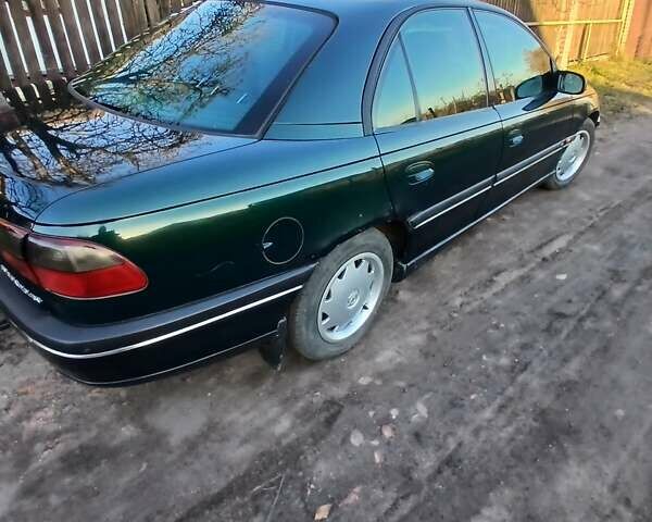 Зелений Опель Омега, об'ємом двигуна 2 л та пробігом 397 тис. км за 1000 $, фото 6 на Automoto.ua