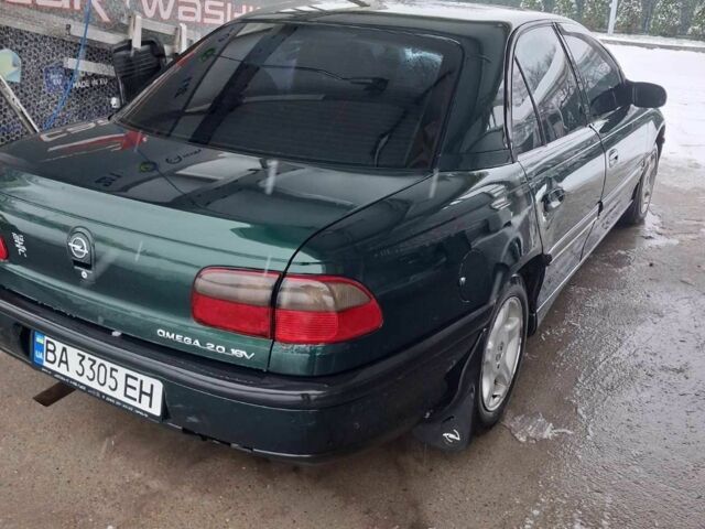 Зеленый Опель Омега, объемом двигателя 2 л и пробегом 418 тыс. км за 1500 $, фото 4 на Automoto.ua