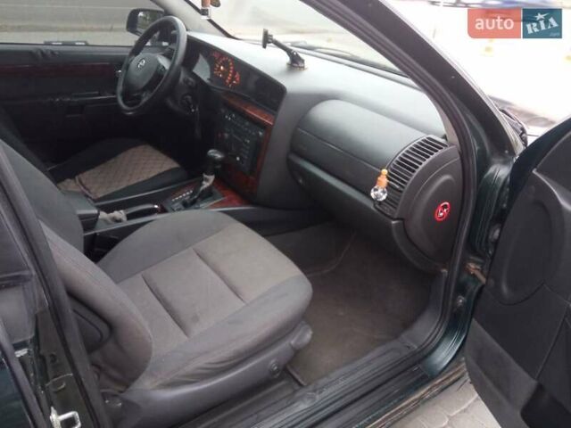 Зеленый Опель Омега, объемом двигателя 2.2 л и пробегом 324 тыс. км за 2500 $, фото 11 на Automoto.ua