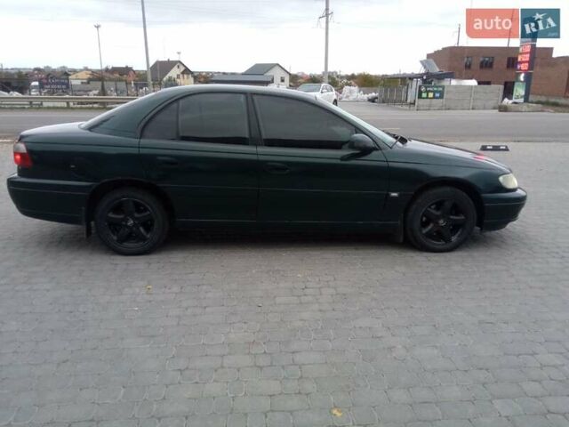 Зеленый Опель Омега, объемом двигателя 2.2 л и пробегом 324 тыс. км за 2500 $, фото 6 на Automoto.ua