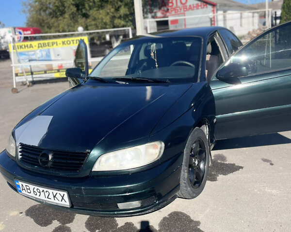 Зеленый Опель Омега, объемом двигателя 2.2 л и пробегом 300 тыс. км за 2500 $, фото 10 на Automoto.ua
