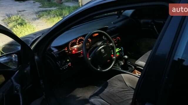 Зелений Опель Омега, об'ємом двигуна 2 л та пробігом 500 тис. км за 2900 $, фото 9 на Automoto.ua